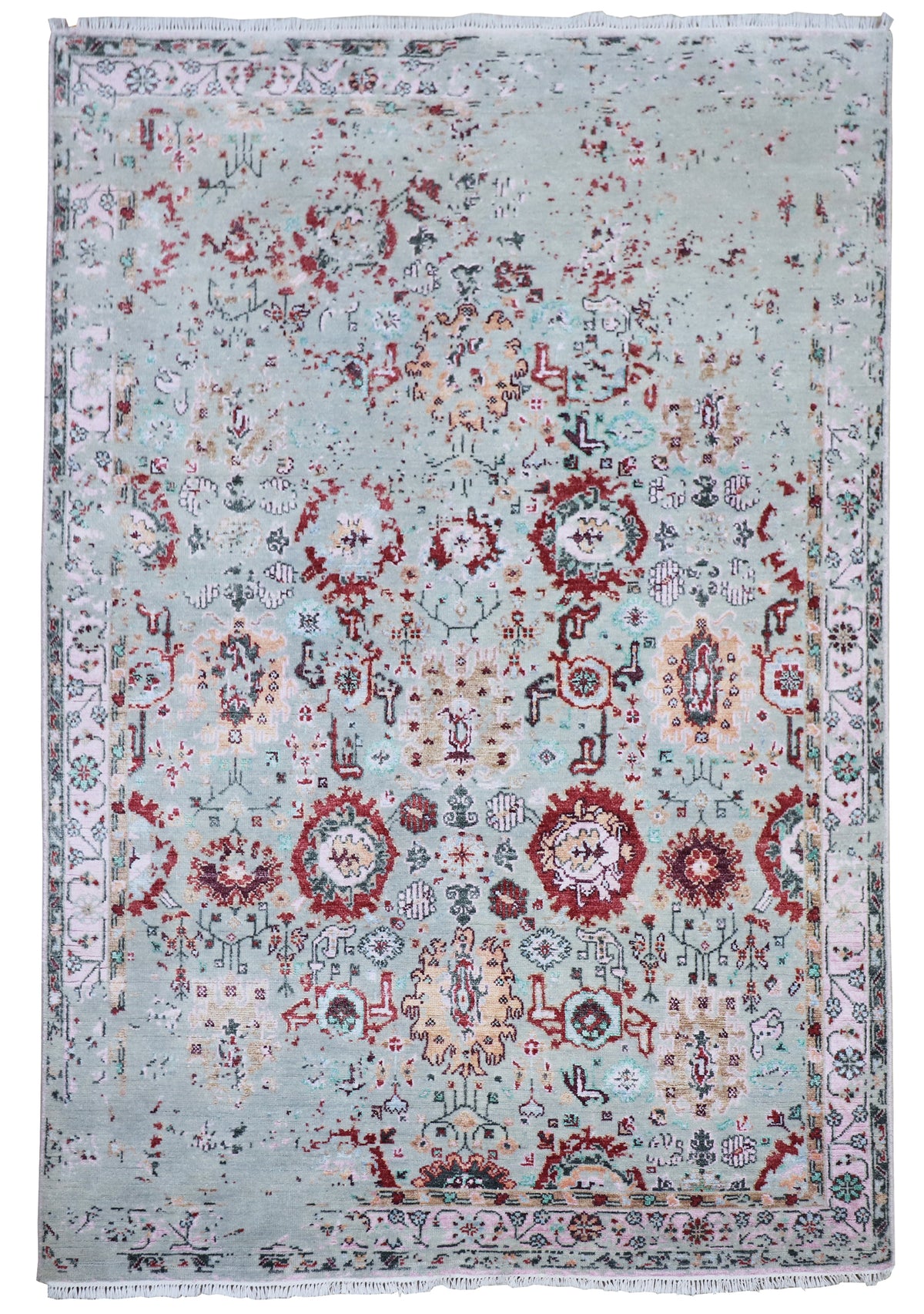 Oushak rug with light blue-gray distressed pattern, red circular medallions, and detailed border