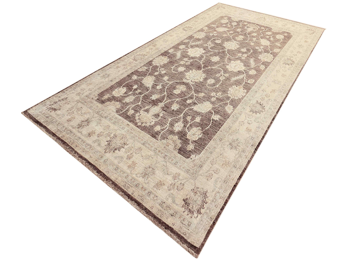 Beige and dark brown Afghan rug with centered floral vine panel and framed border