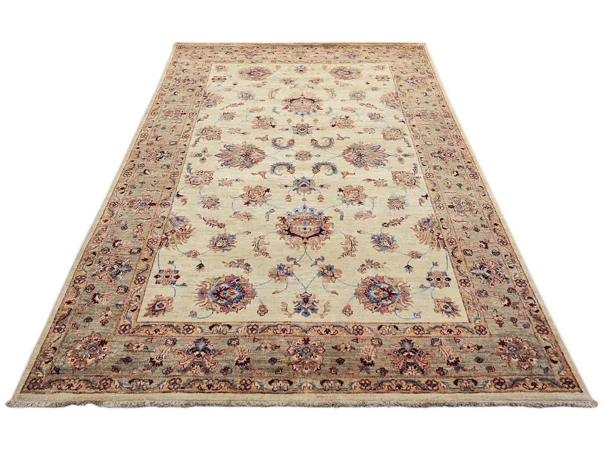 Large cream area rug with central floral medallion and ornate multicolor border; flat weave