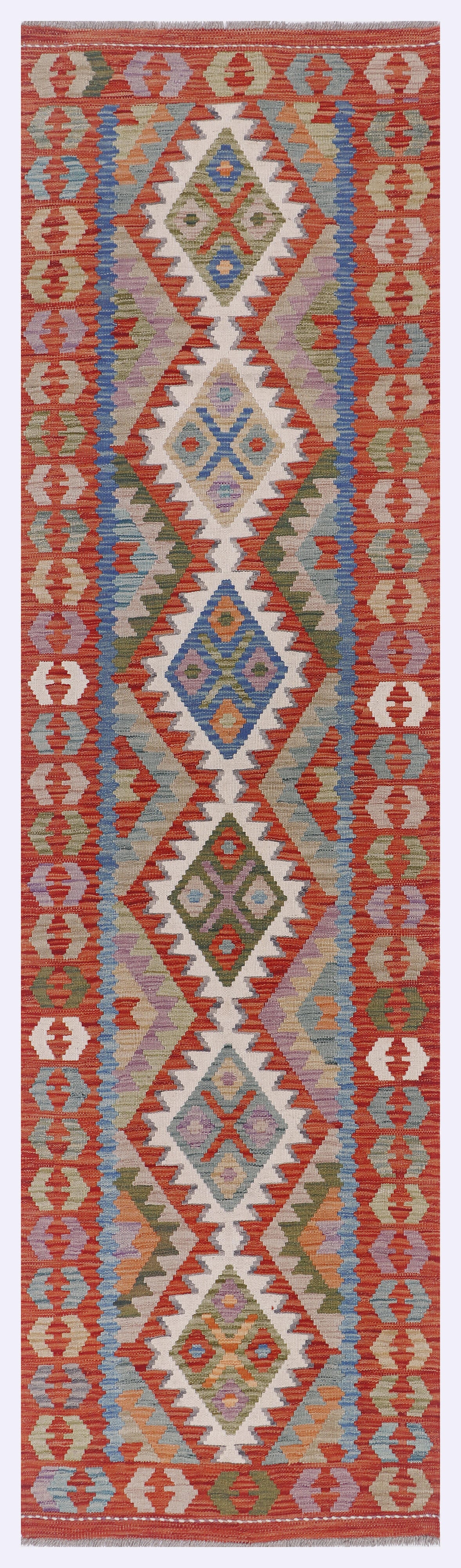 Kilim rug in orange with geometric diamond medallion pattern in blue, teal, and cream