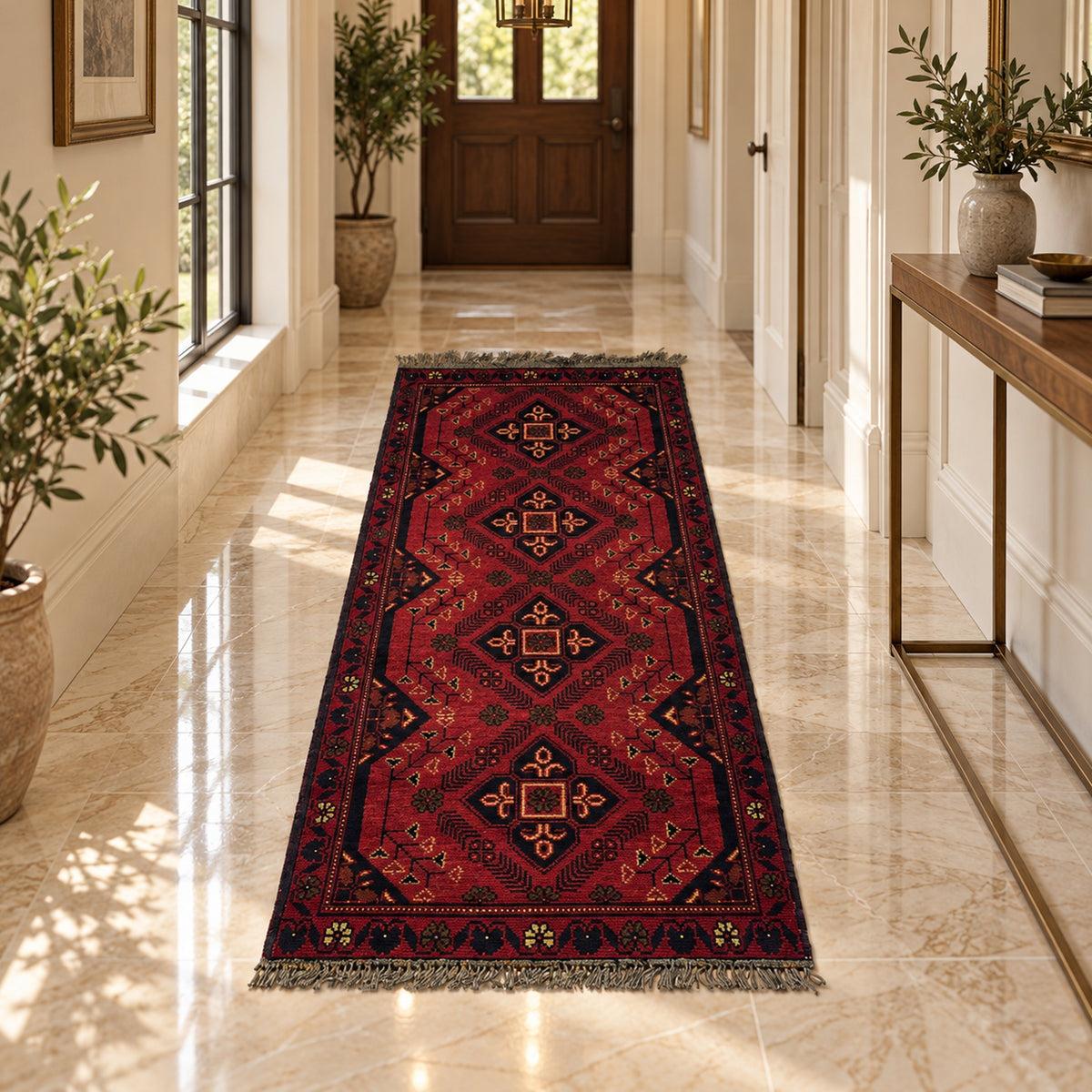 Red geometric runner rug placed on a floor with fringed ends and central medallions