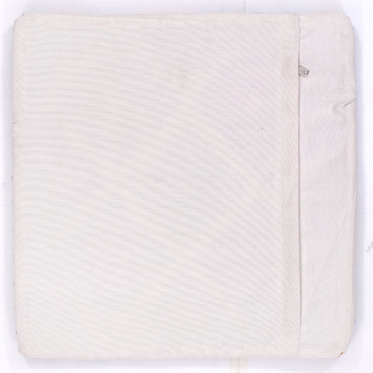 Off-white back of square kilim cushion with seam detail and small label