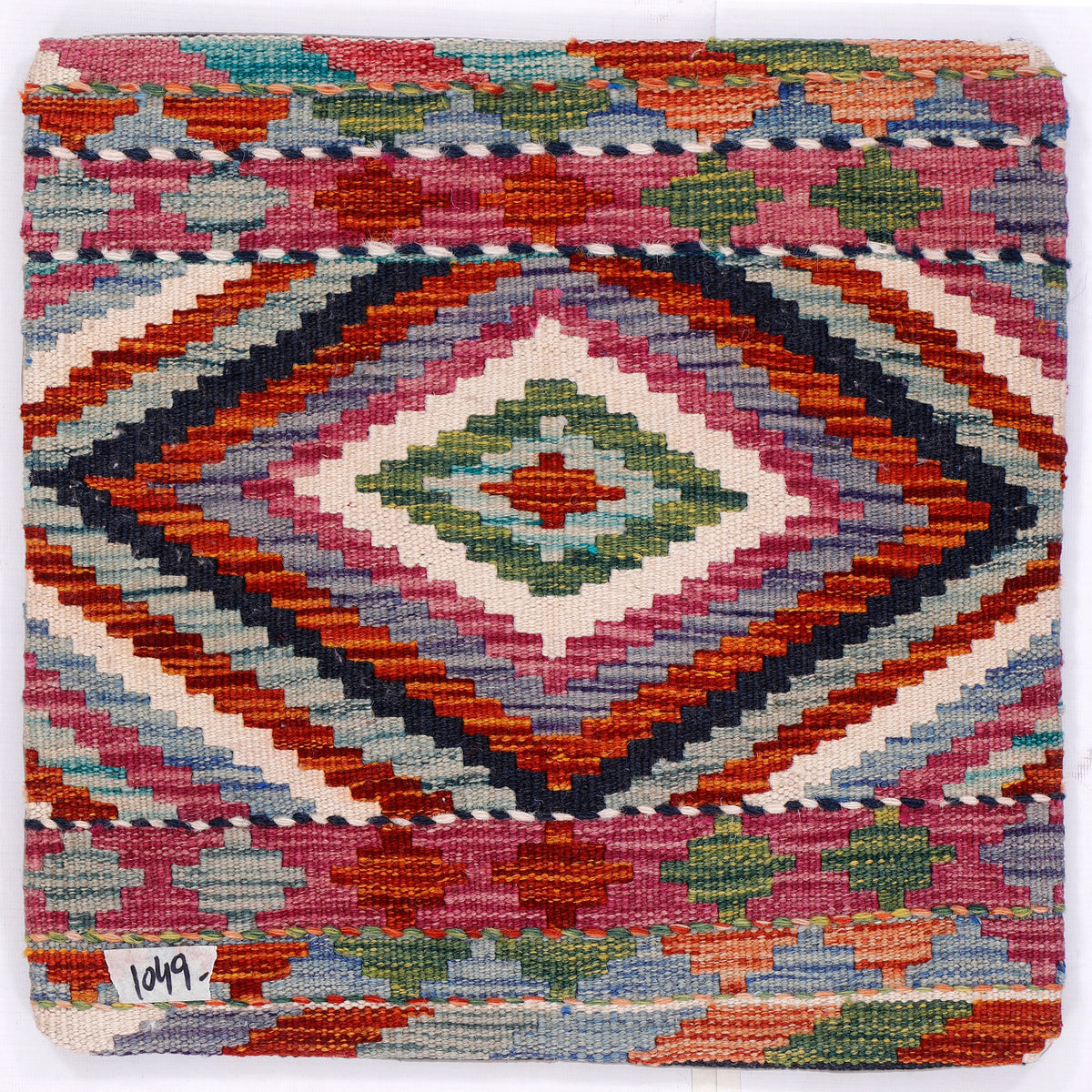 Kilim pillow cover with multicolor diamond pattern on textured woven fabric