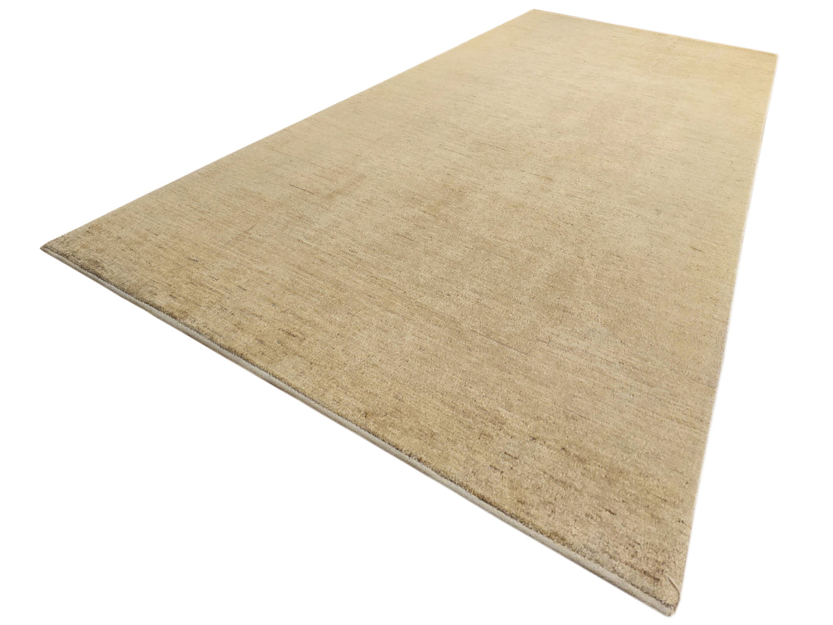 Light beige rug corner with tight flat weave and soft border