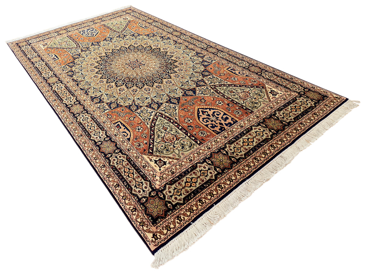 Rectangular multicolor Tabriz rug with central medallion and fringe edges