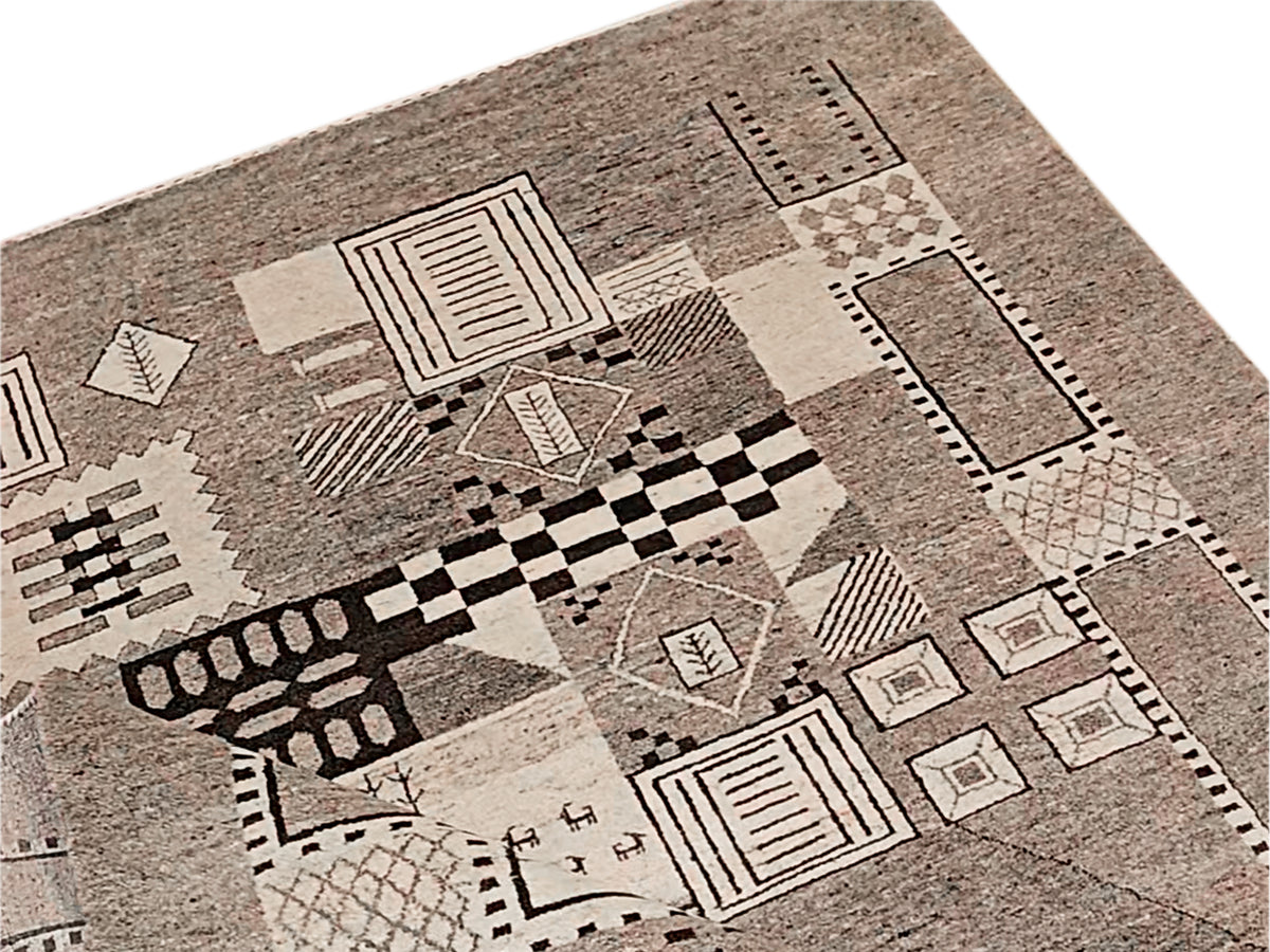 Geometric patchwork rug with checker and rectangle motifs in gray and beige