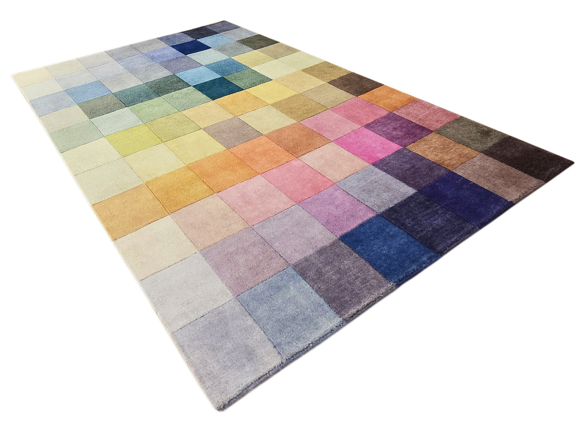 Multicolor patchwork rug with mixed squares in blue, green, pink, orange, and beige