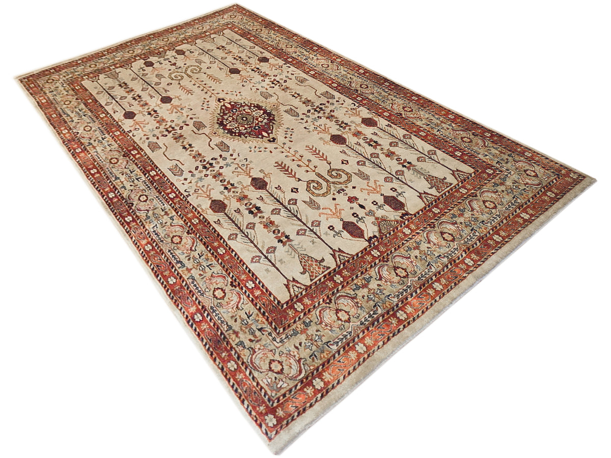 Rectangular rug with ivory field, rust border, and central floral medallion