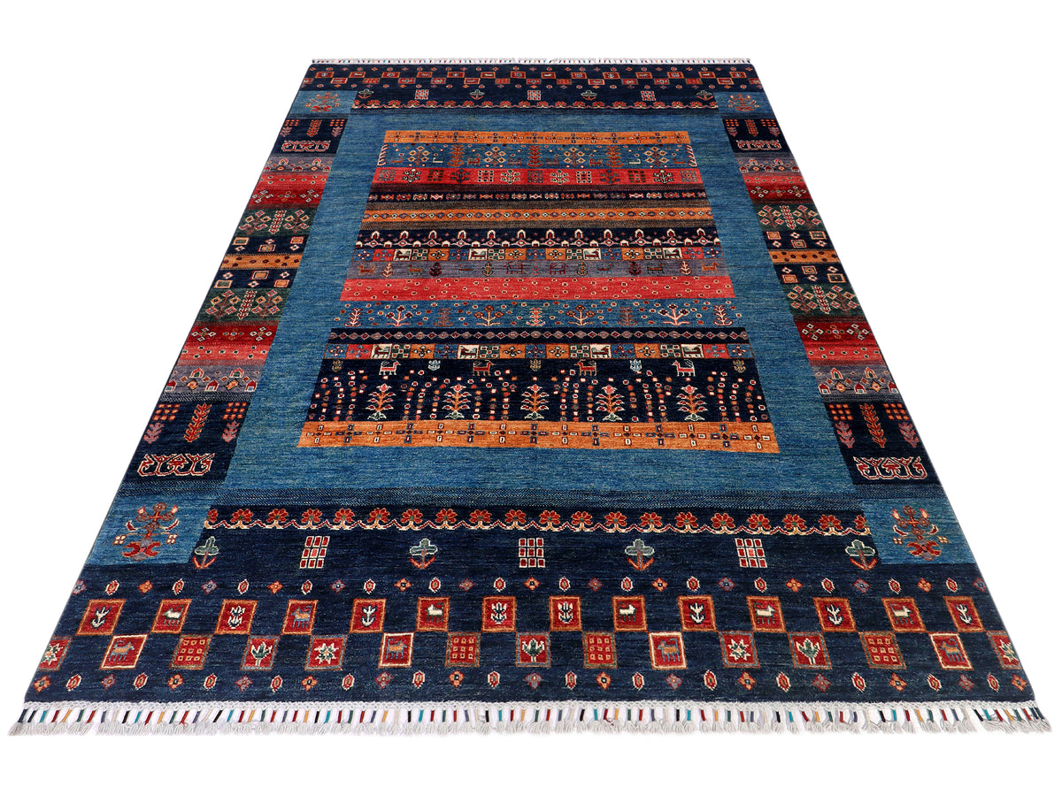 Gabbeh Afghan rug wide view with navy blue field, orange-red stripes, and decorative borders