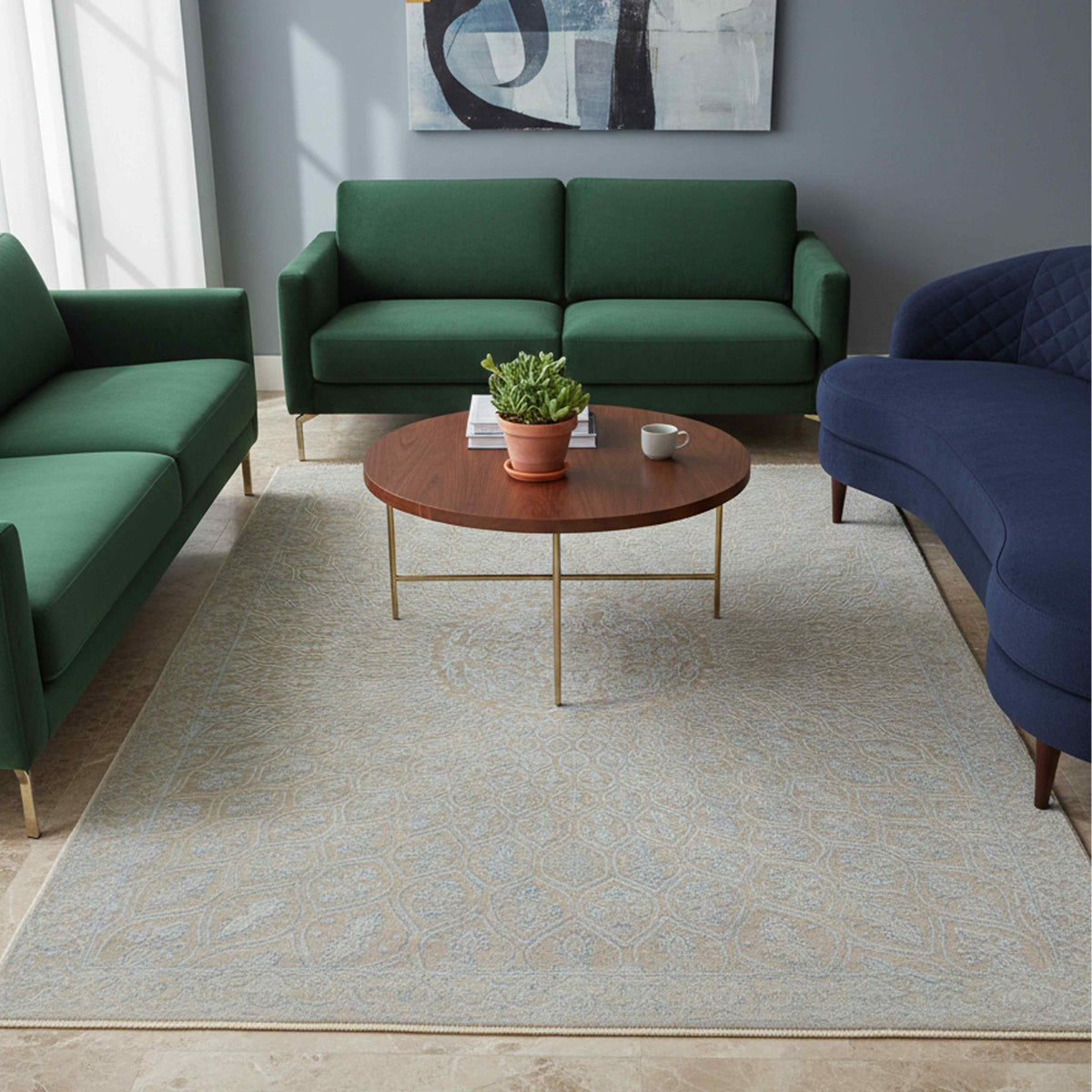 Light blue-gray patterned area rug placed on a floor in a living room setting.