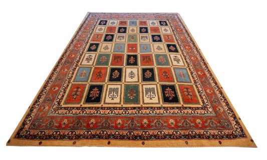 Large geometric rug with red border, navy center, and beige square panels in angled view