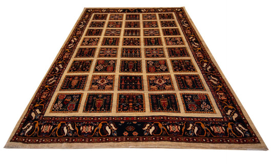Rectangular rug, patchwork square pattern with navy and rust ornate border, flat view