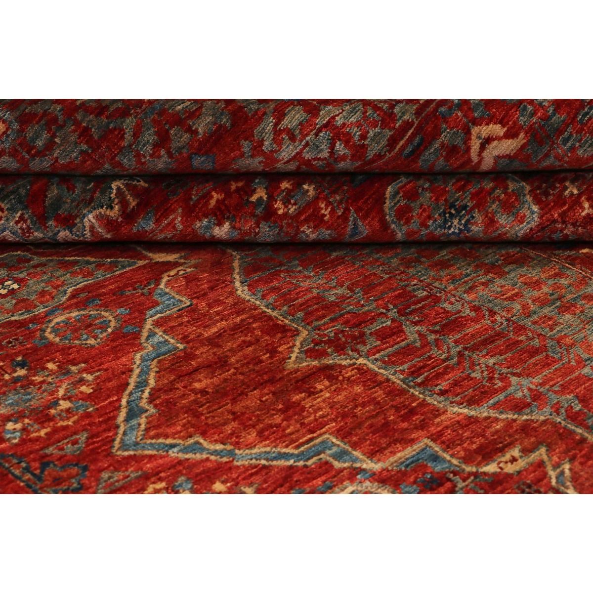 Mamluk rug folded edge showing red floral pattern and textured pile