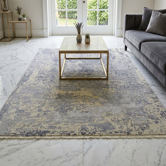 Modern area rug with distressed abstract design, light gray and blue, fringed edges