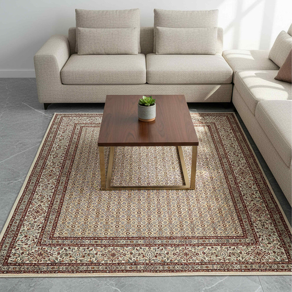 Persian area rug in living room setting, ivory base with rust red and patterned border