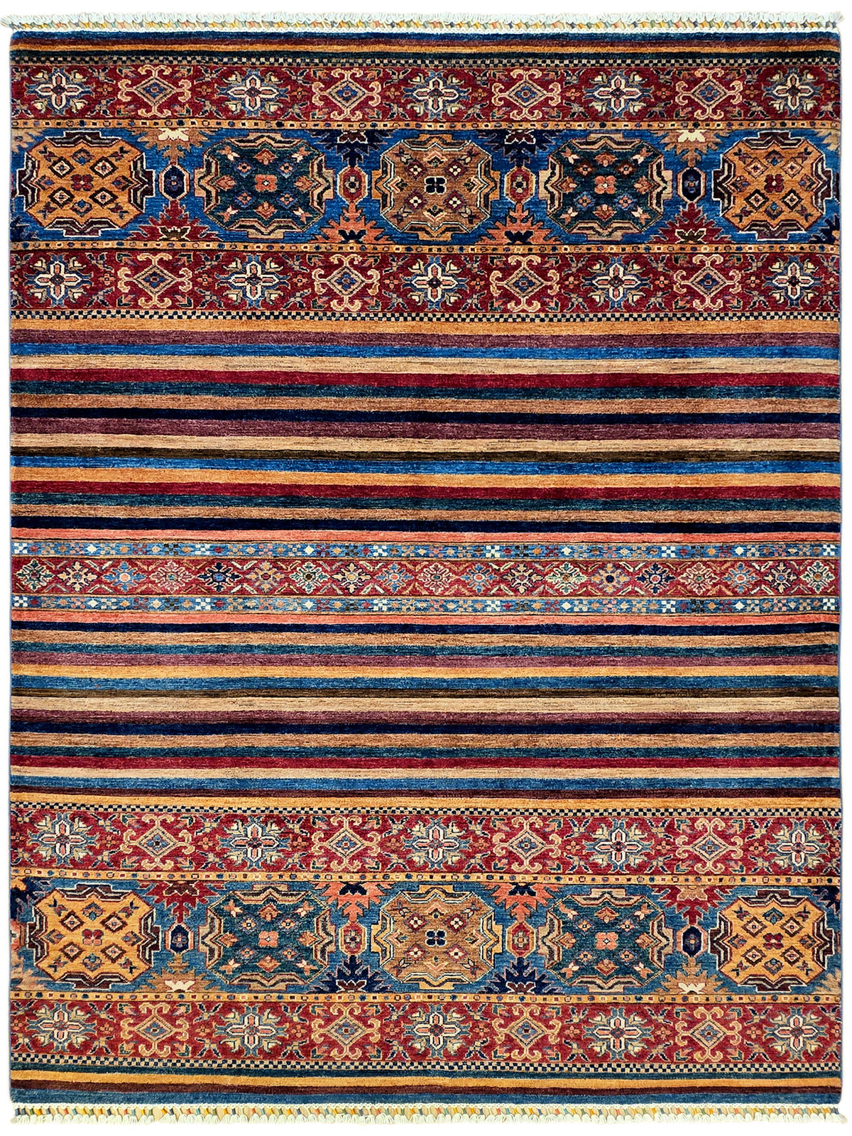 Rectangular rug with symmetrical medallions, geometric patterns, stripes, and fringed edges