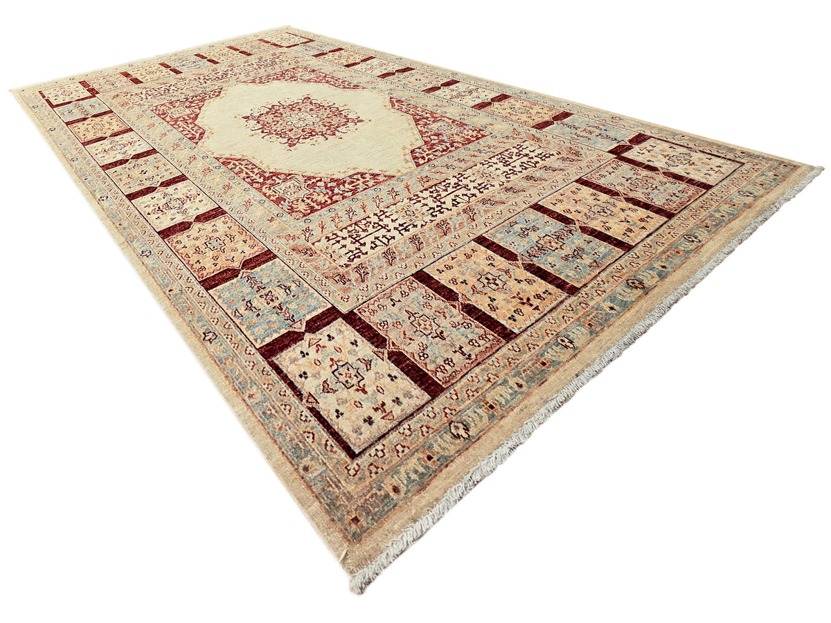Ariana area rug with cream field, red ornamental medallion, and multicolor patchwork border.