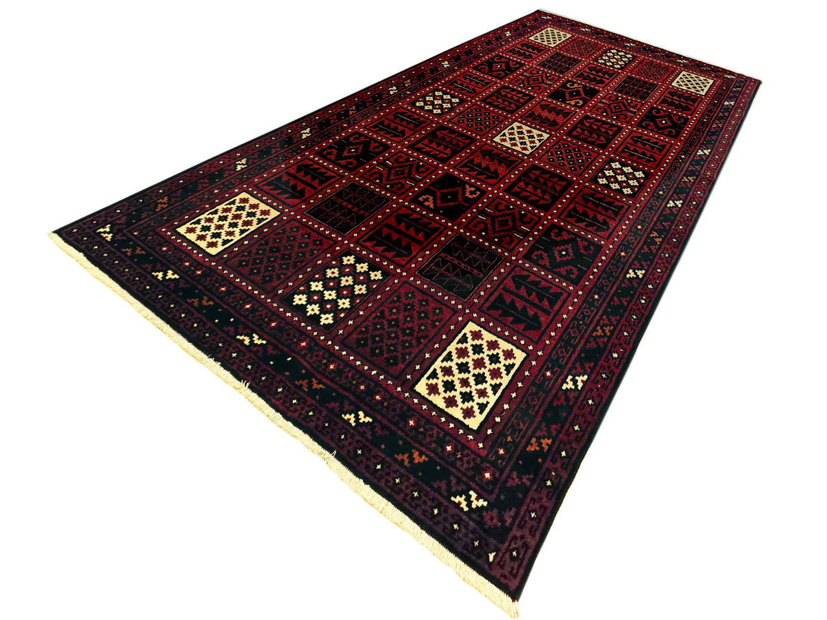 Persian-style area rug with dark red geometric pattern, cream accents, and decorative border.