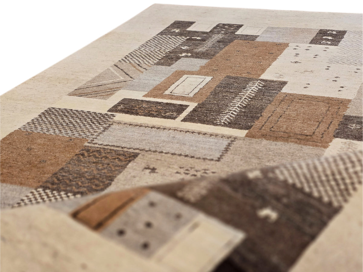 Close-up of rug surface showing beige and brown patches with black patterned details