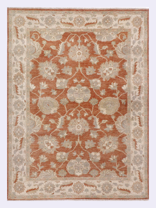 Terracotta and beige patterned area rug, rectangular with ornate floral motif