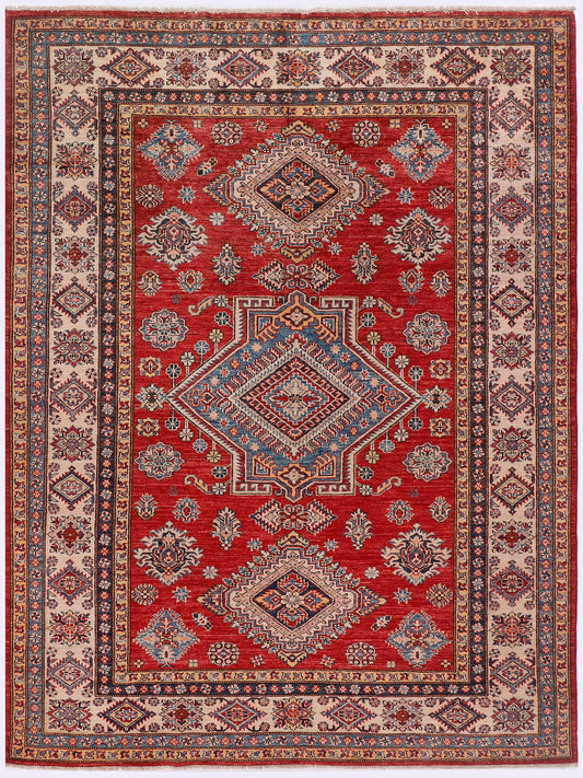 Kazak rug 239x173 cm with red field, blue border, diamond medallion pattern