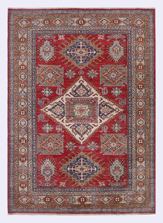 Red Kazak rug with geometric medallion and border pattern, 270x150 cm
