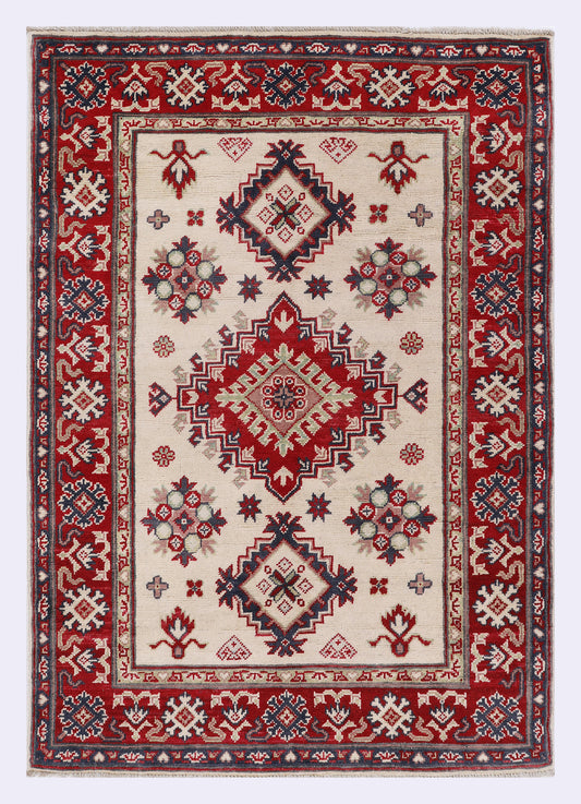 Red geometric rug with border patterns and medallion center, 148x102 cm