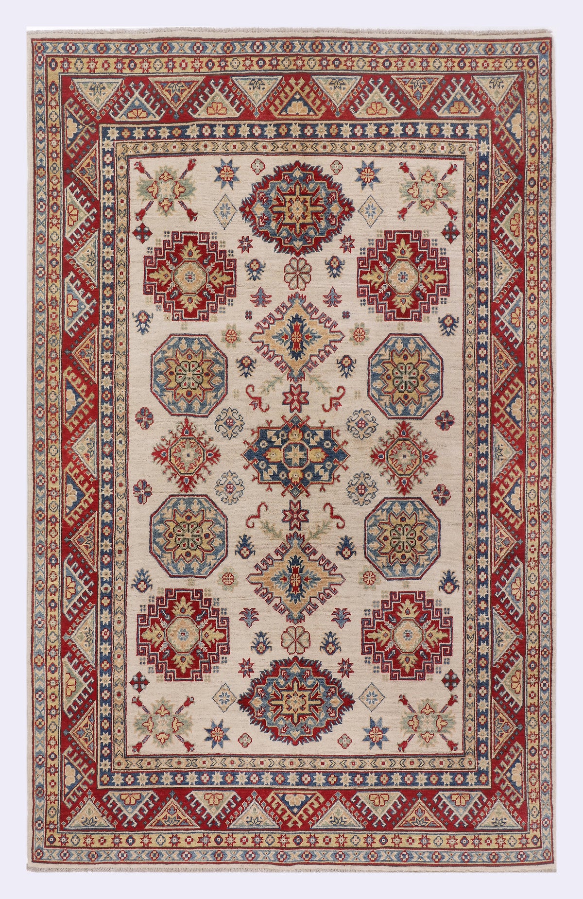 Red and cream geometric rug with central medallion and patterned border