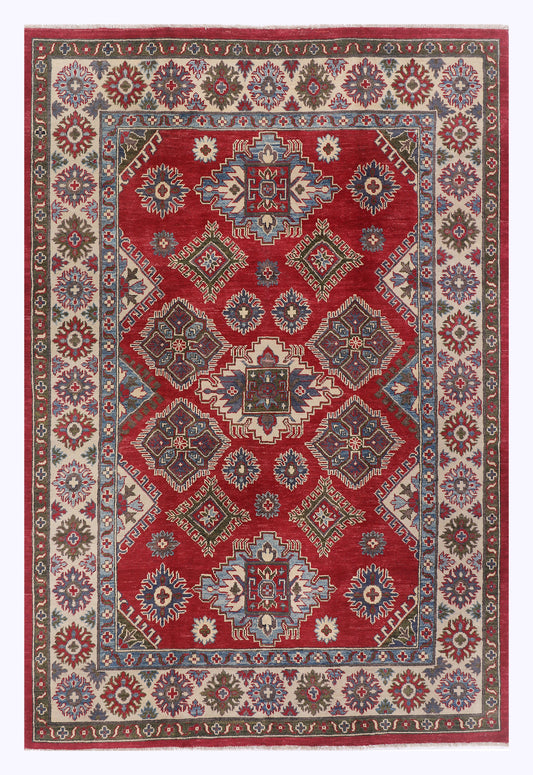 Red geometric medallion area rug with navy border and floral accents, rectangular