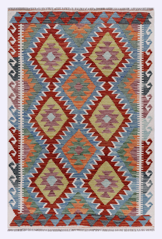 Red blue beige kilim rug with geometric diamond pattern and fringed border