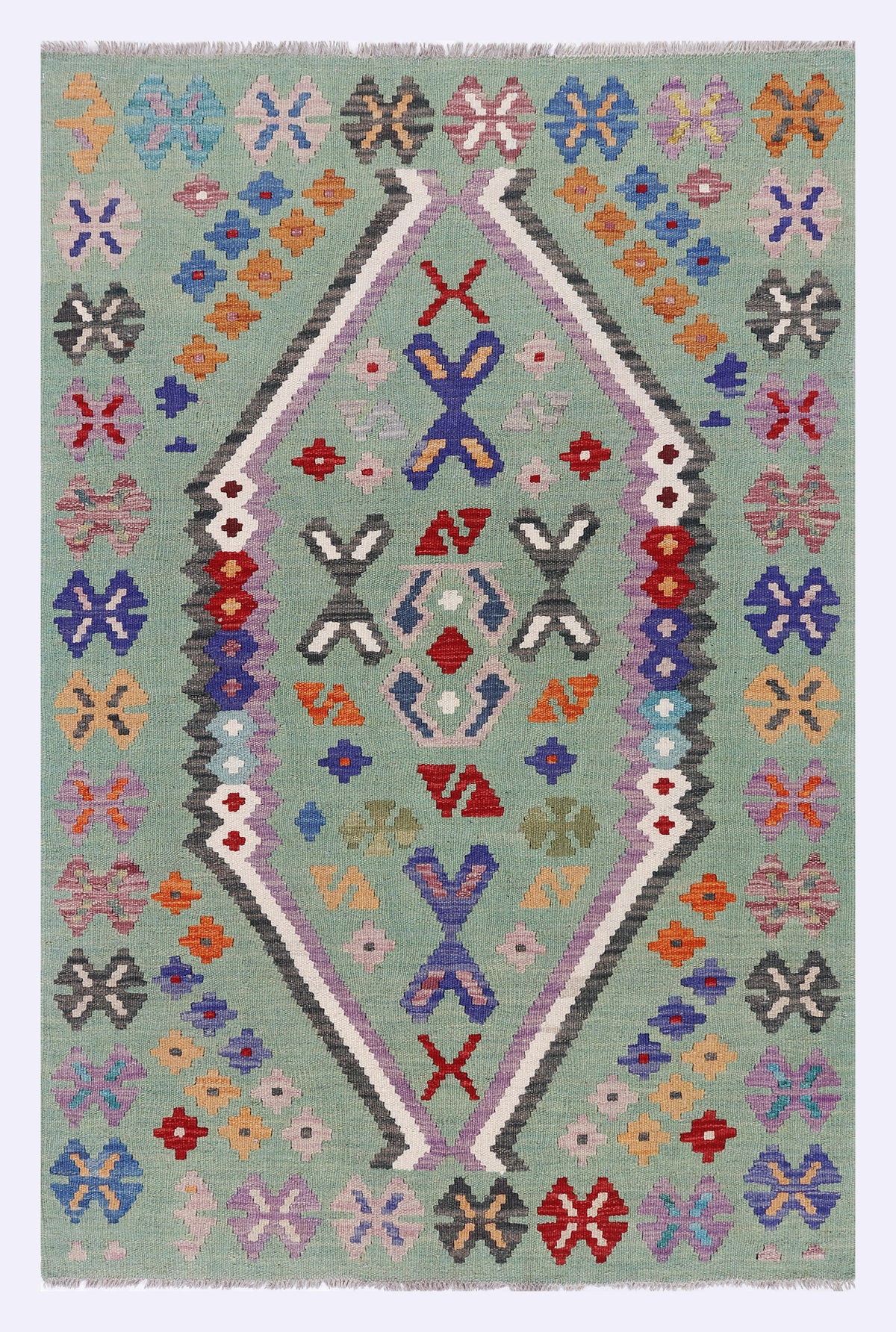 Green kilim rug with multicolor geometric diamond motifs and floral accents, 152x99 cm