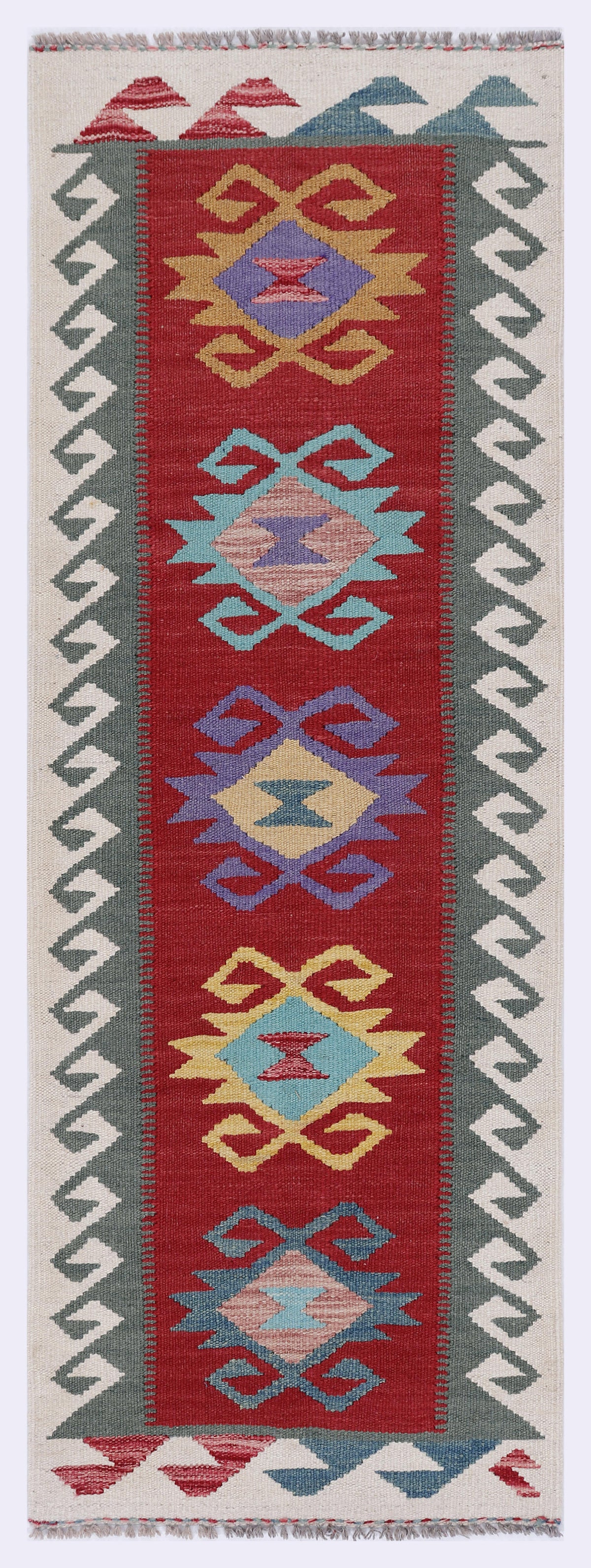 Rectangular red kilim rug with multicolor geometric medallion pattern and zigzag border
