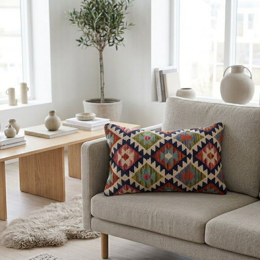 Geometric kilim cushion cover on beige sofa with multicolor diamond pattern, 35x55 cm