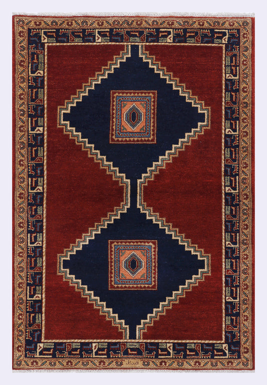 Red geometric rug with navy border and diamond medallions, 153x109 cm