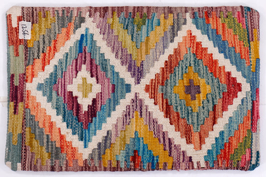 Kilim cushion cover close-up of blue diamond motifs with multicolor stitching