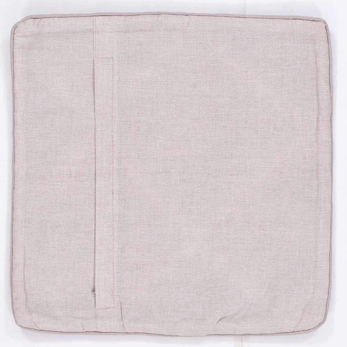 Light beige kilim cushion back with plain woven fabric and centered seam