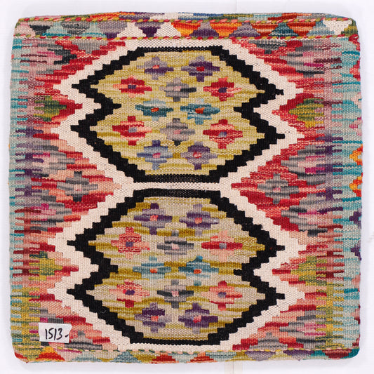 Kilim pillow cover close-up with red, black, and gold double medallion pattern