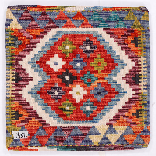 Red kilim cushion with central medallion motif and geometric border, 45x45 cm