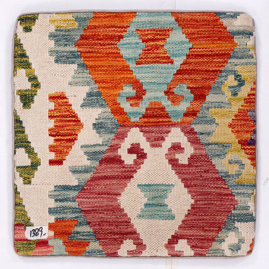 Tribal kilim cushion with geometric pattern, cream base, orange and blue red blocks