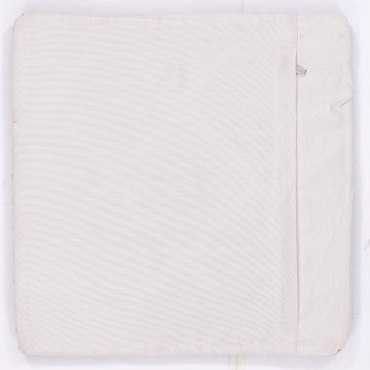 Off-white kilim cushion back with smooth fabric and visible side seam