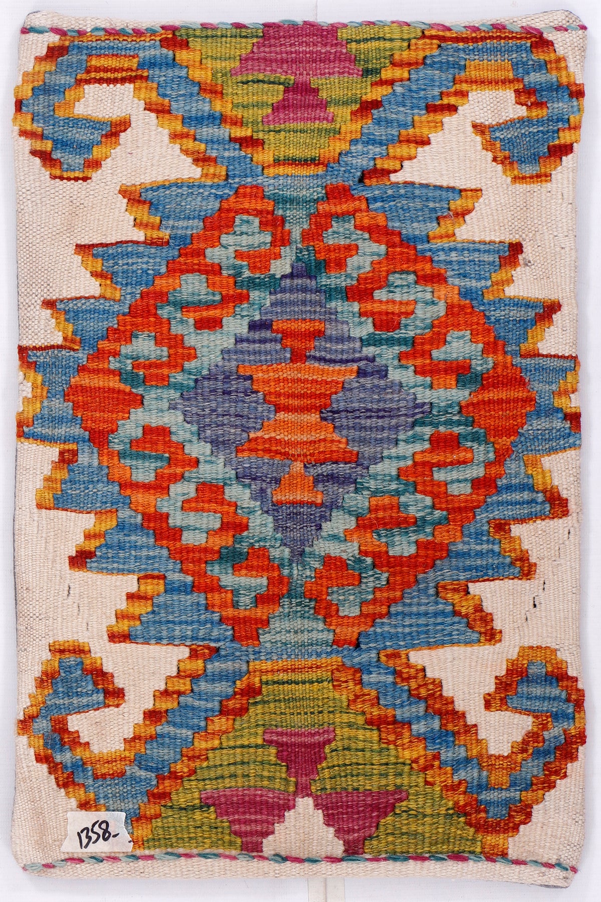 Kilim cushion cover front with multicolor geometric pattern on off-white fabric