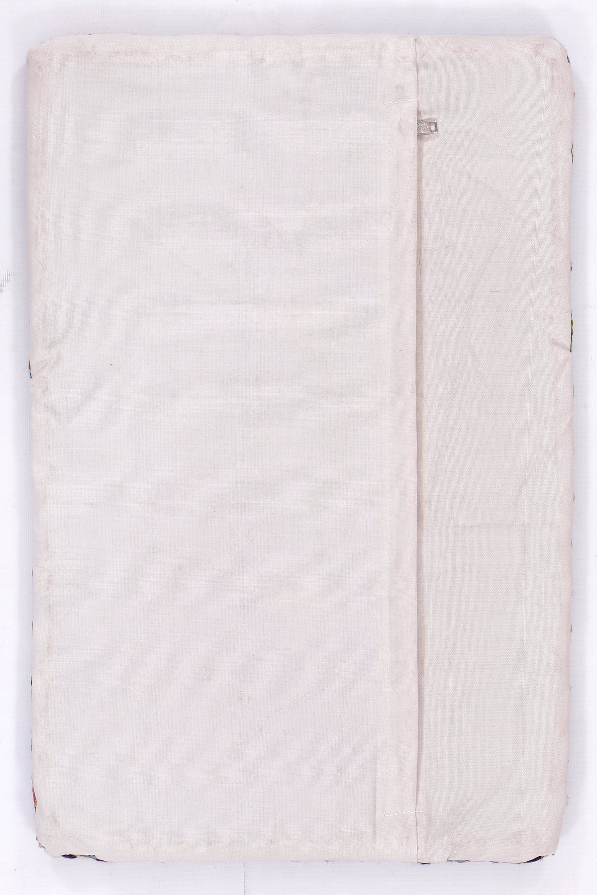 Off-white kilim cushion cover with visible seam and zipper, 35x55 cm
