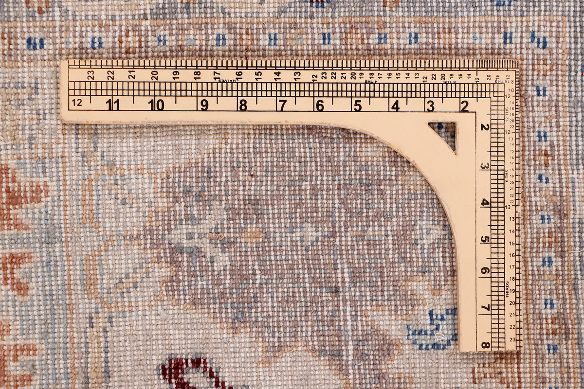 Khyber Oushak rug corner, light blue with geometric motifs and border, measured