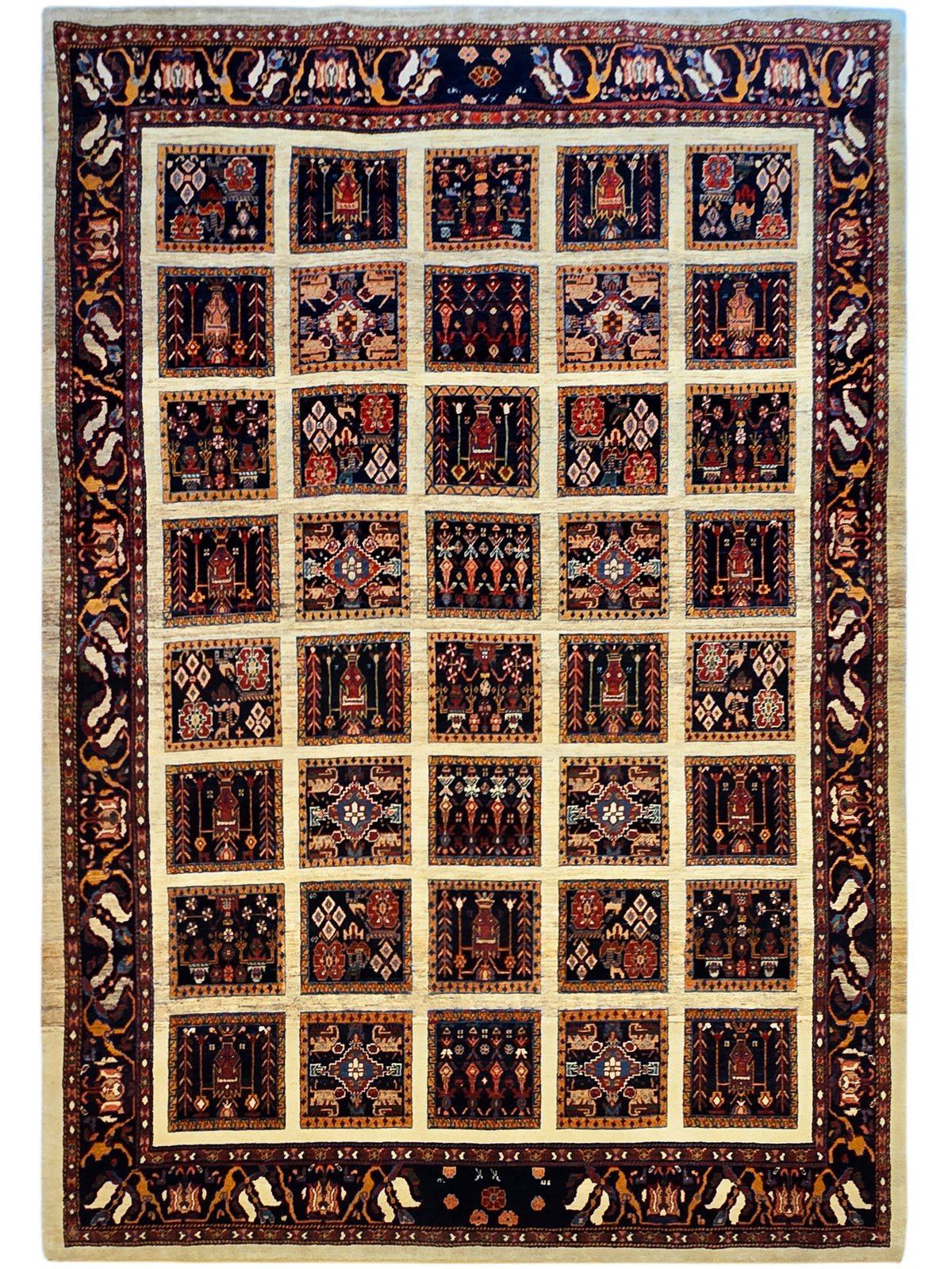 Loribaft rug, navy and rust patchwork squares with beige grid and ornate border