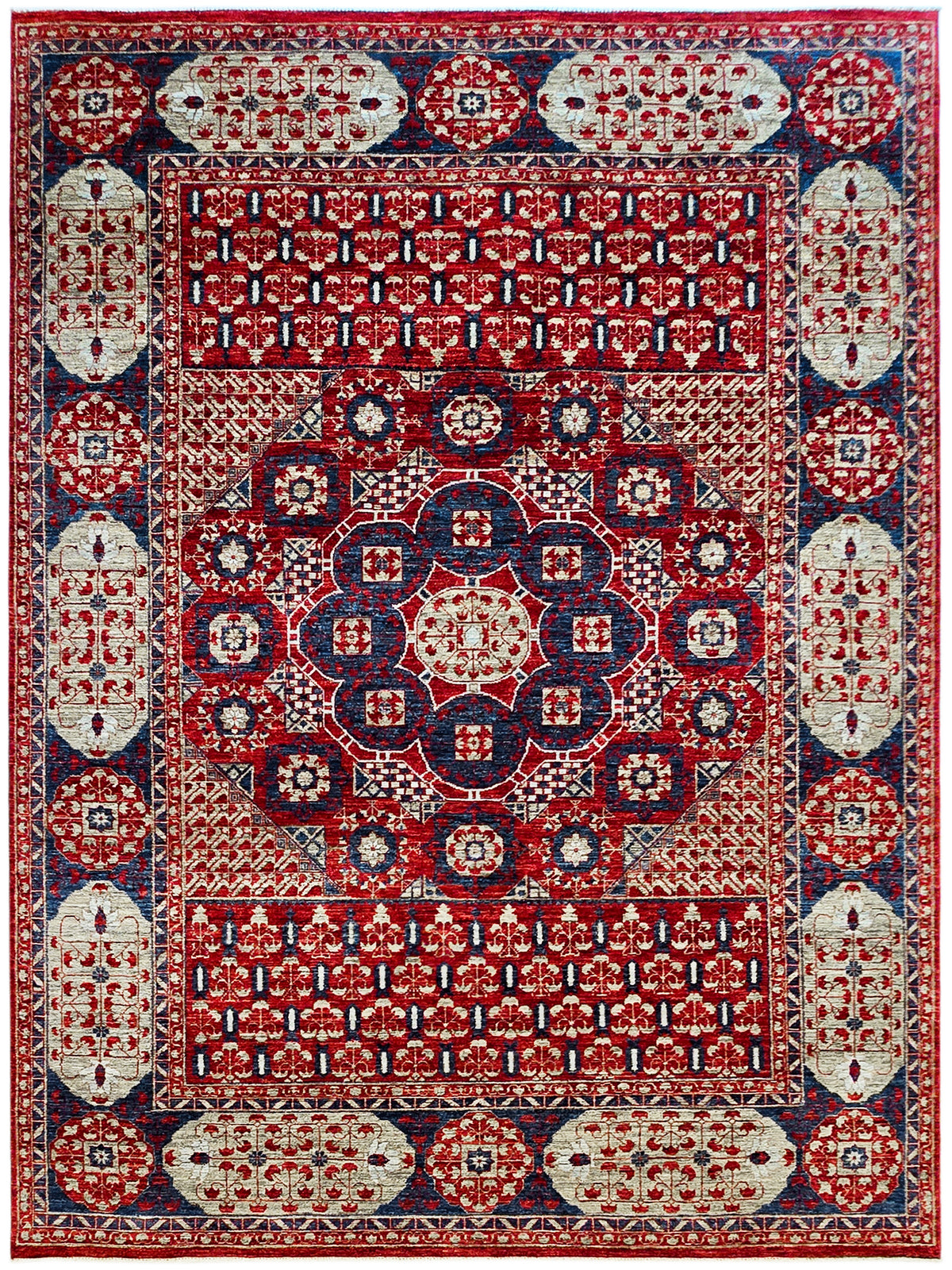 Mamluk rug with deep red field, navy accents, and ornate medallion border pattern