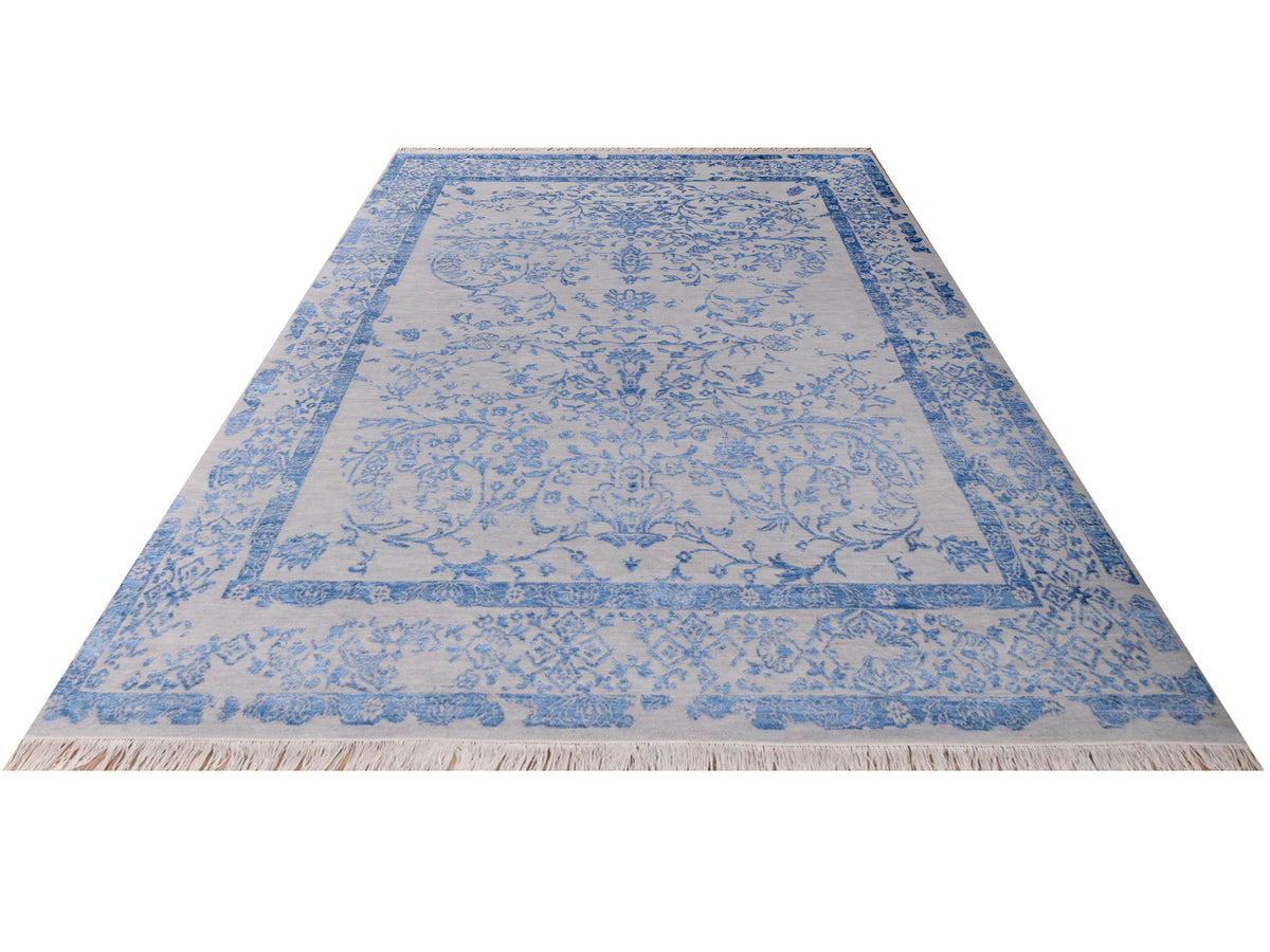 Modern rug 310x244 cm with light base and blue ornate border, rectangular center medallion