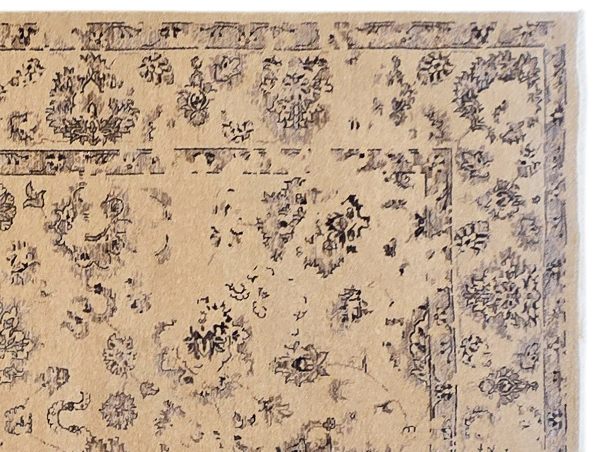 Beige modern rug section with blue-gray medallion and floral motif, close-up detail