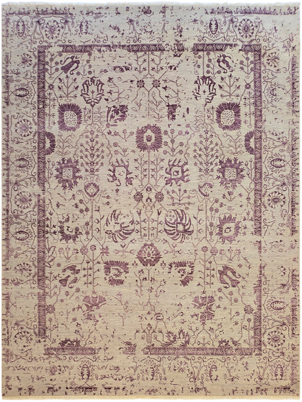Modern beige area rug with dense purple medallion pattern and decorative border