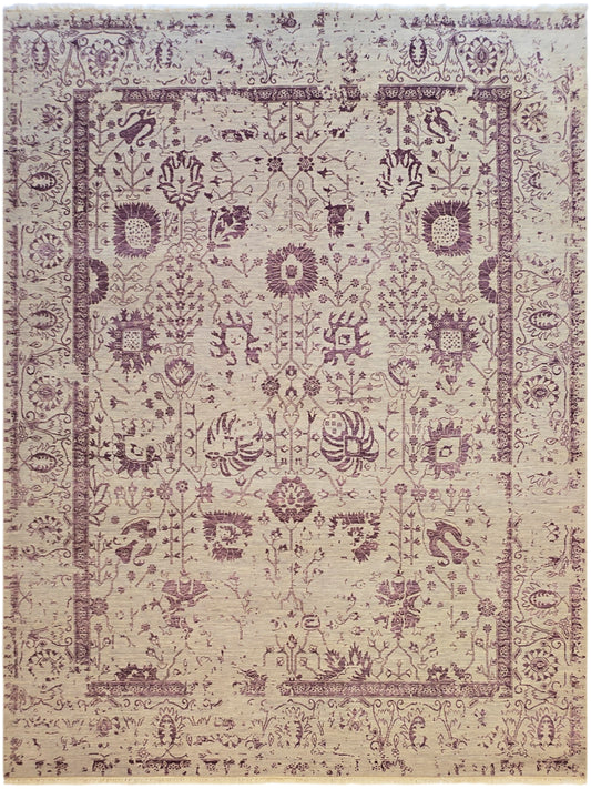 Modern beige area rug with dense purple medallion pattern and decorative border