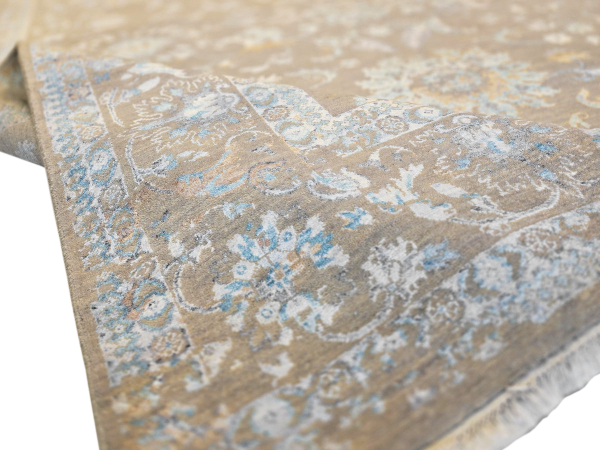 Modern area rug corner with ornate floral medallions, beige and light blue, fringe